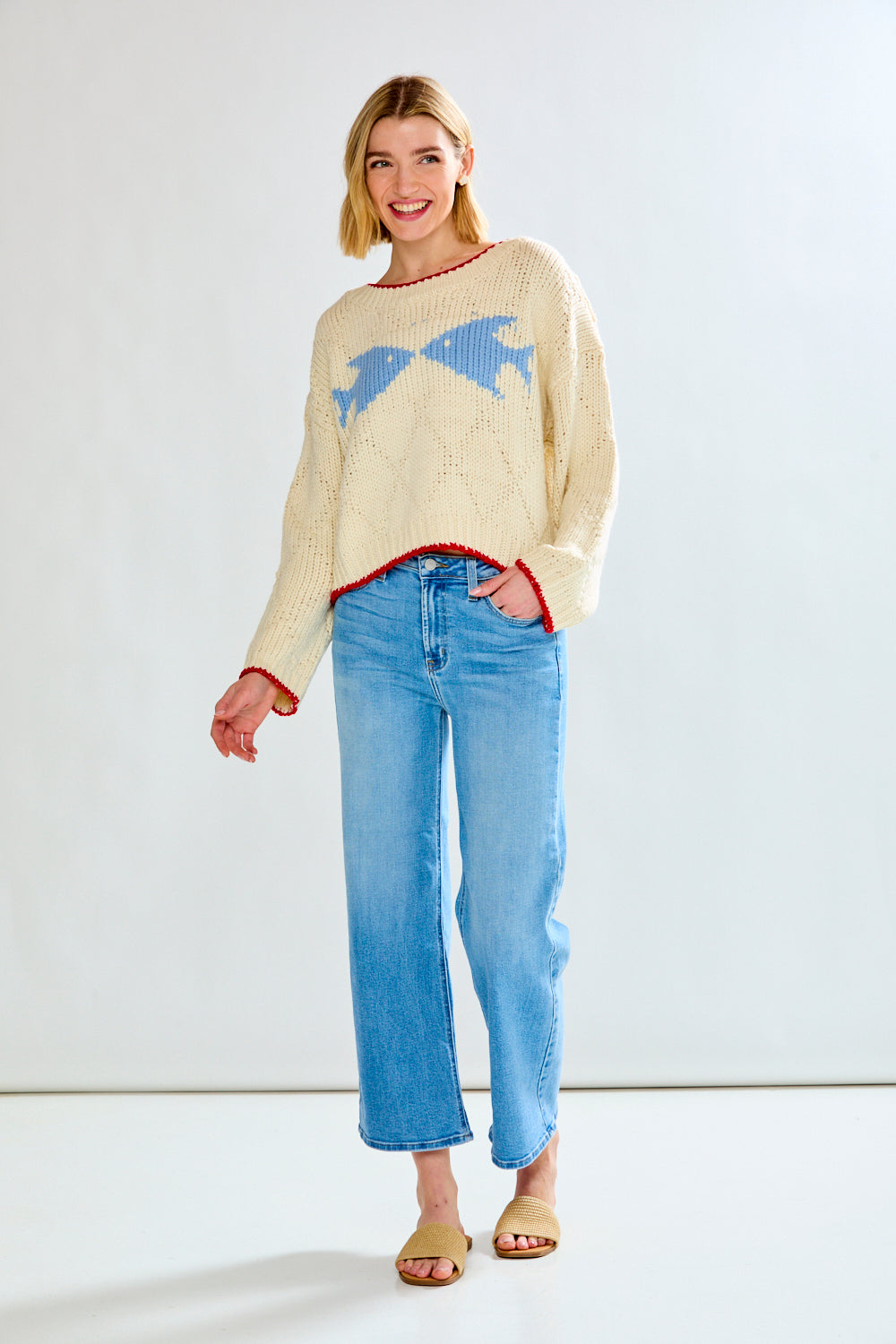 Woman with cream fish sweater on
