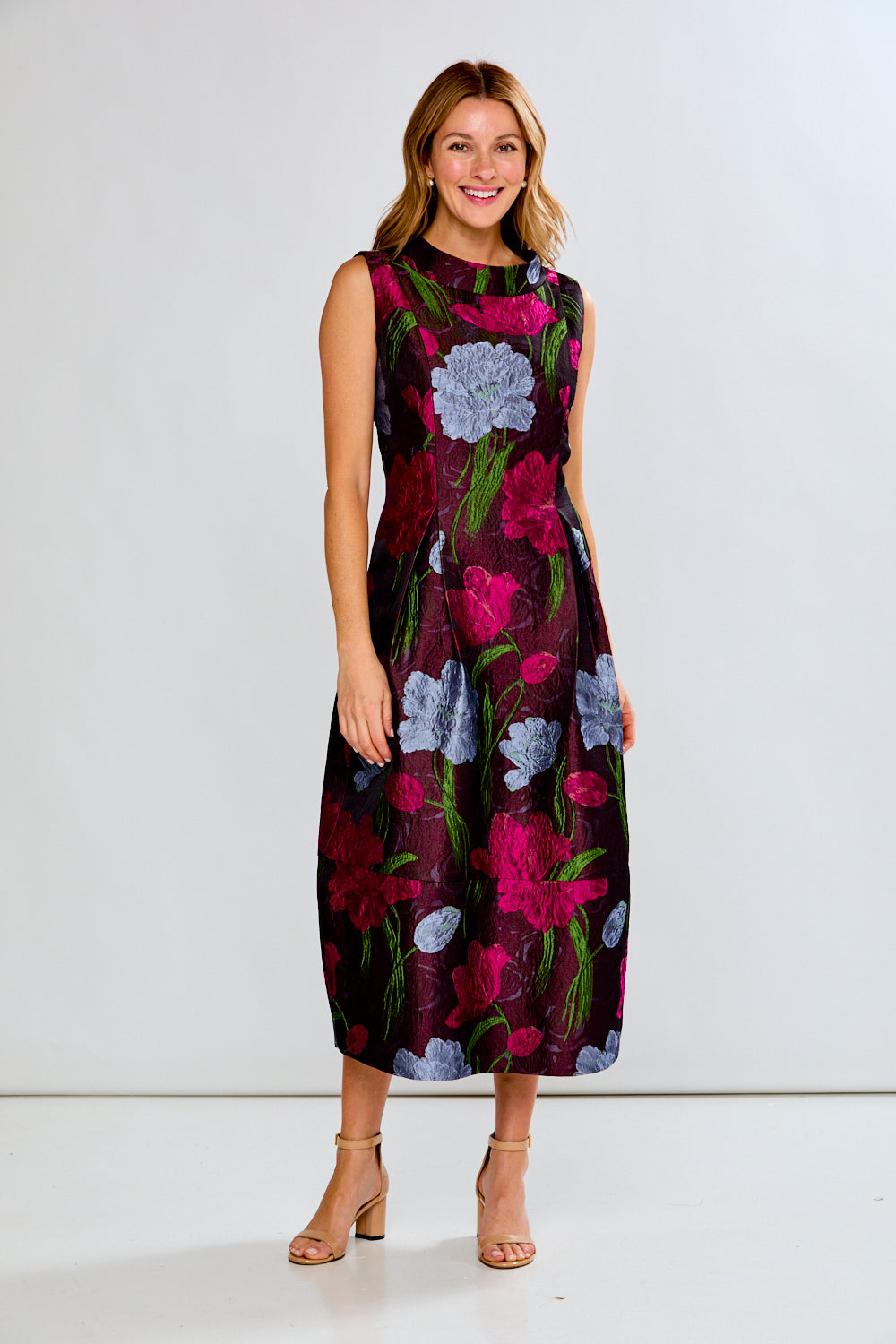Woman wearing a floral dress on a white background