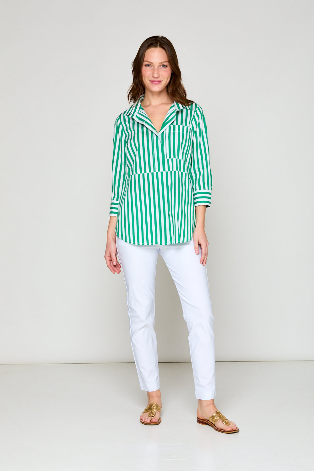 Woman in green and white stripe blouse