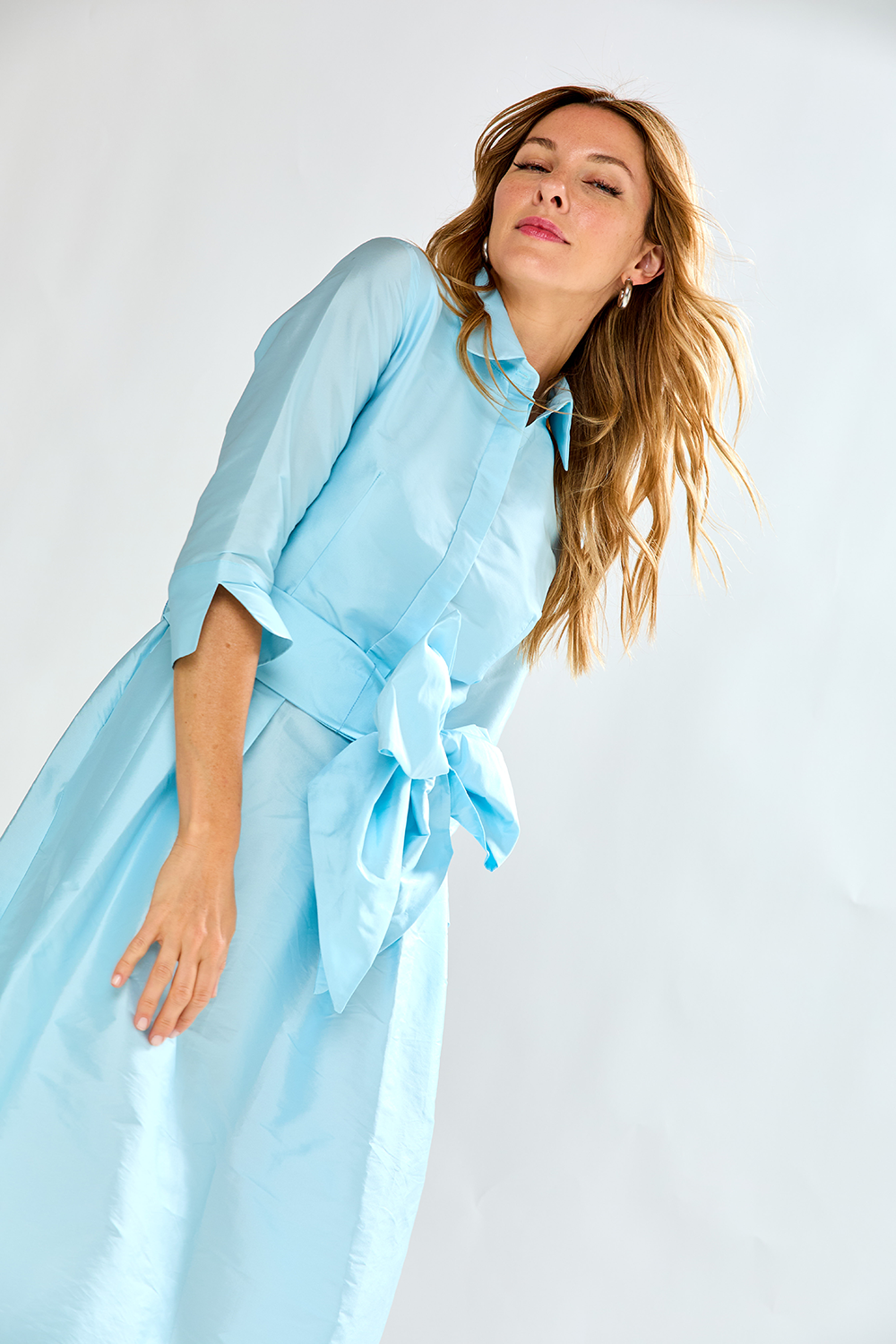Woman in french blue taffeta dress