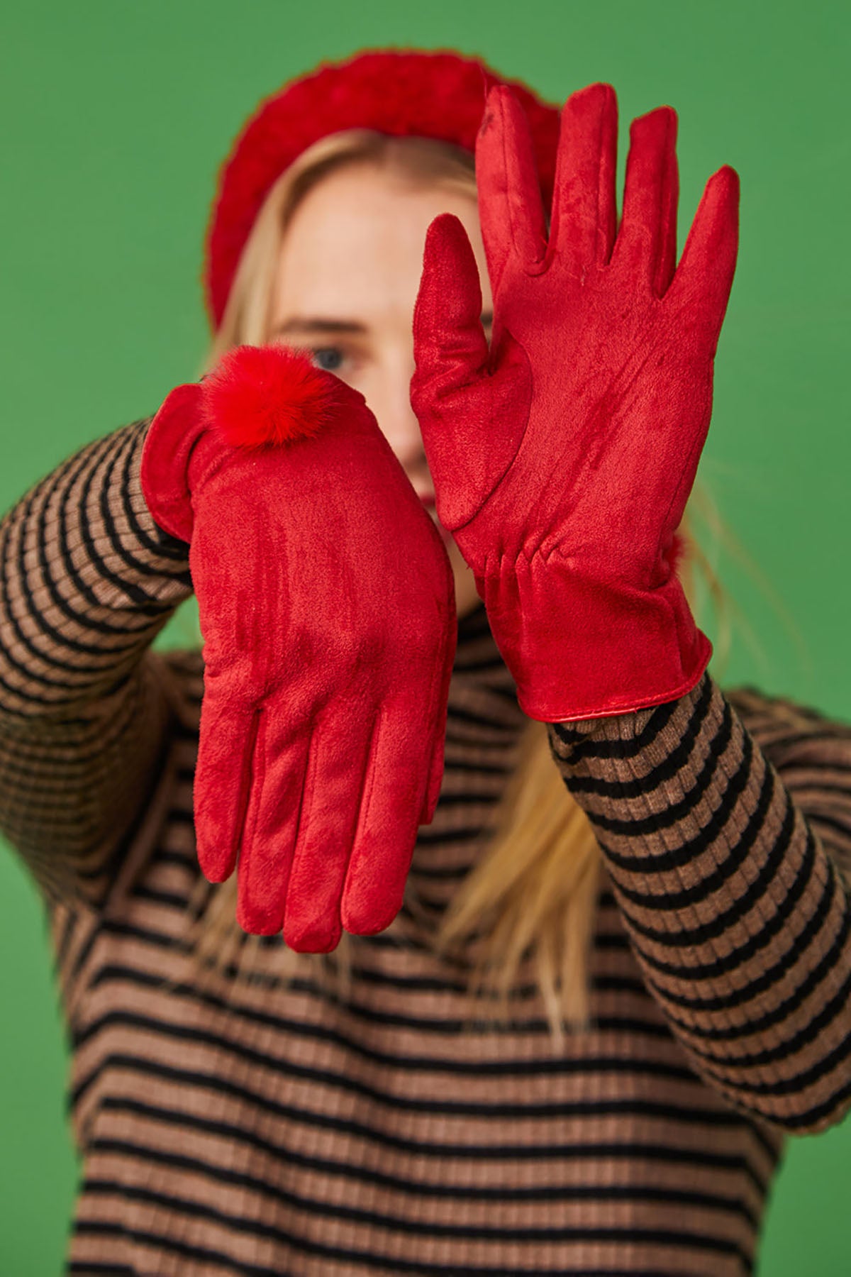 Woman in red faux suede faux fur gloves