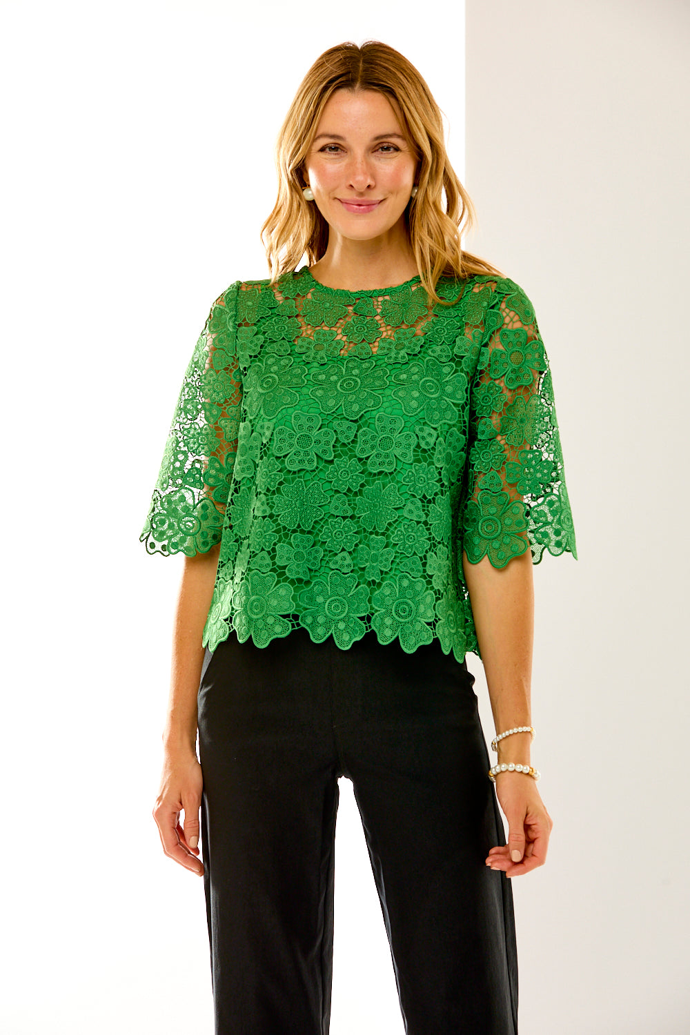 woman in green lace top 