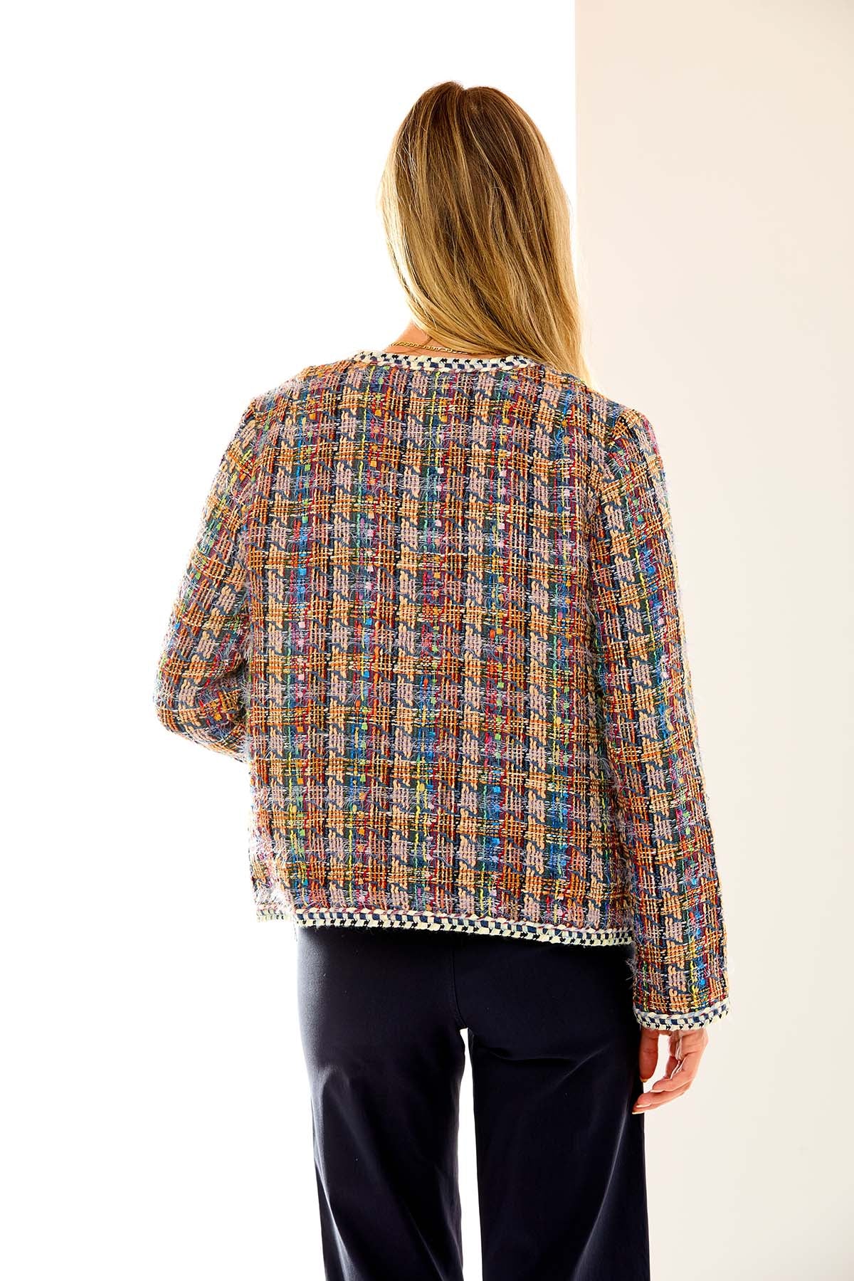 Woman in multi tweed jacket