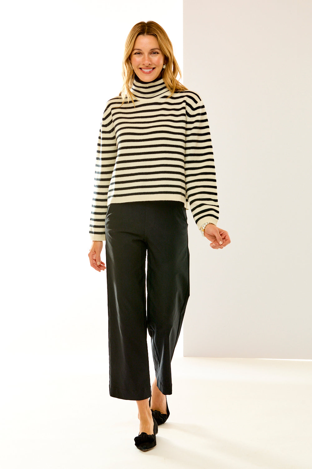 woman in black and white striped sweater 