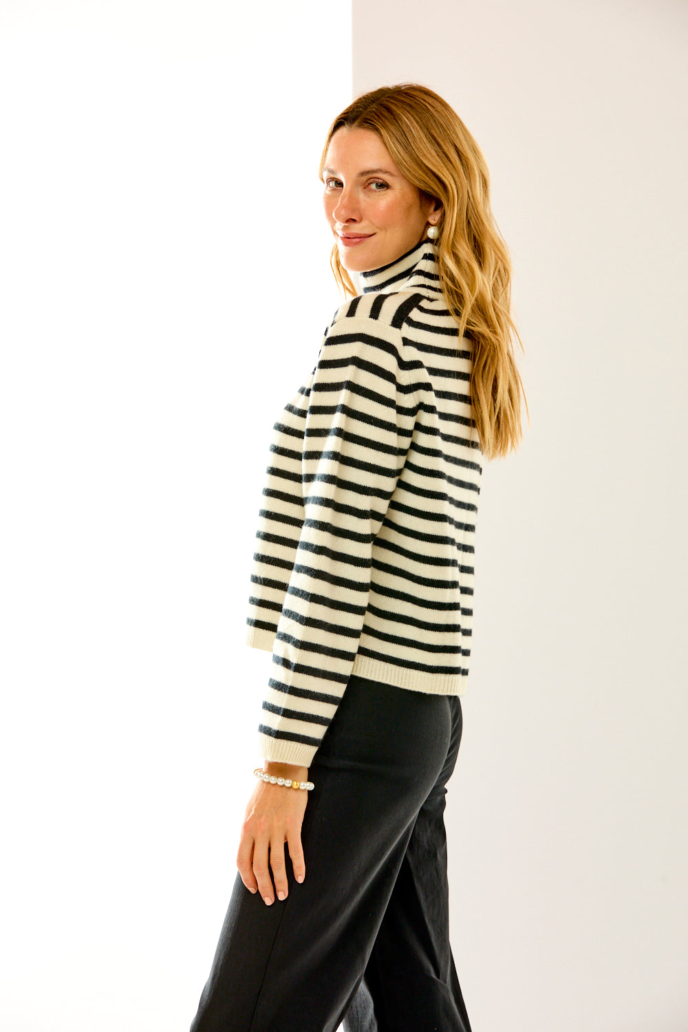 woman in black and white striped sweater 