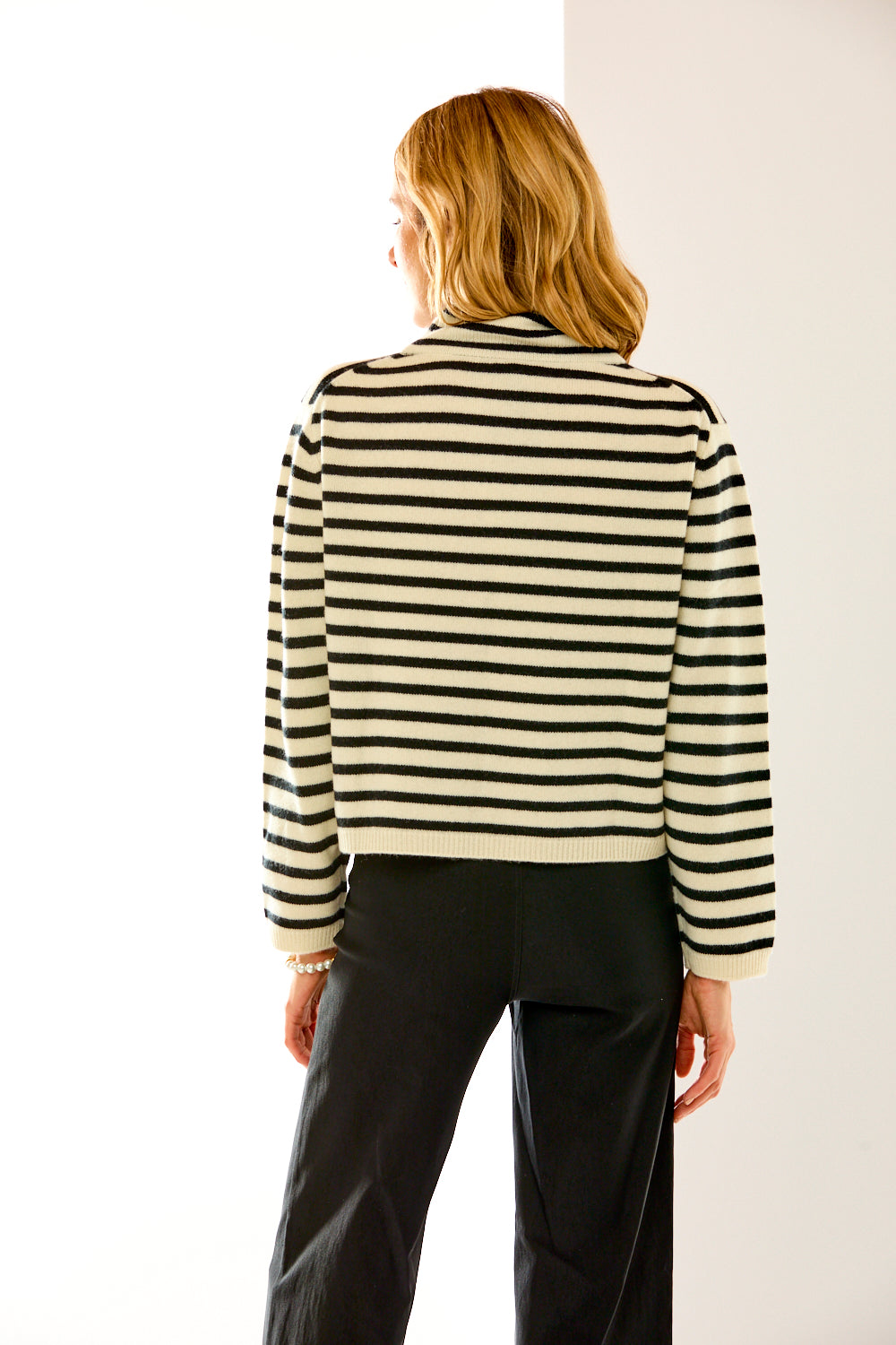 woman in black and white striped sweater 