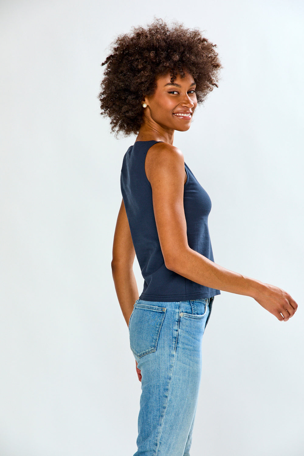 Woman in solid top and jeans