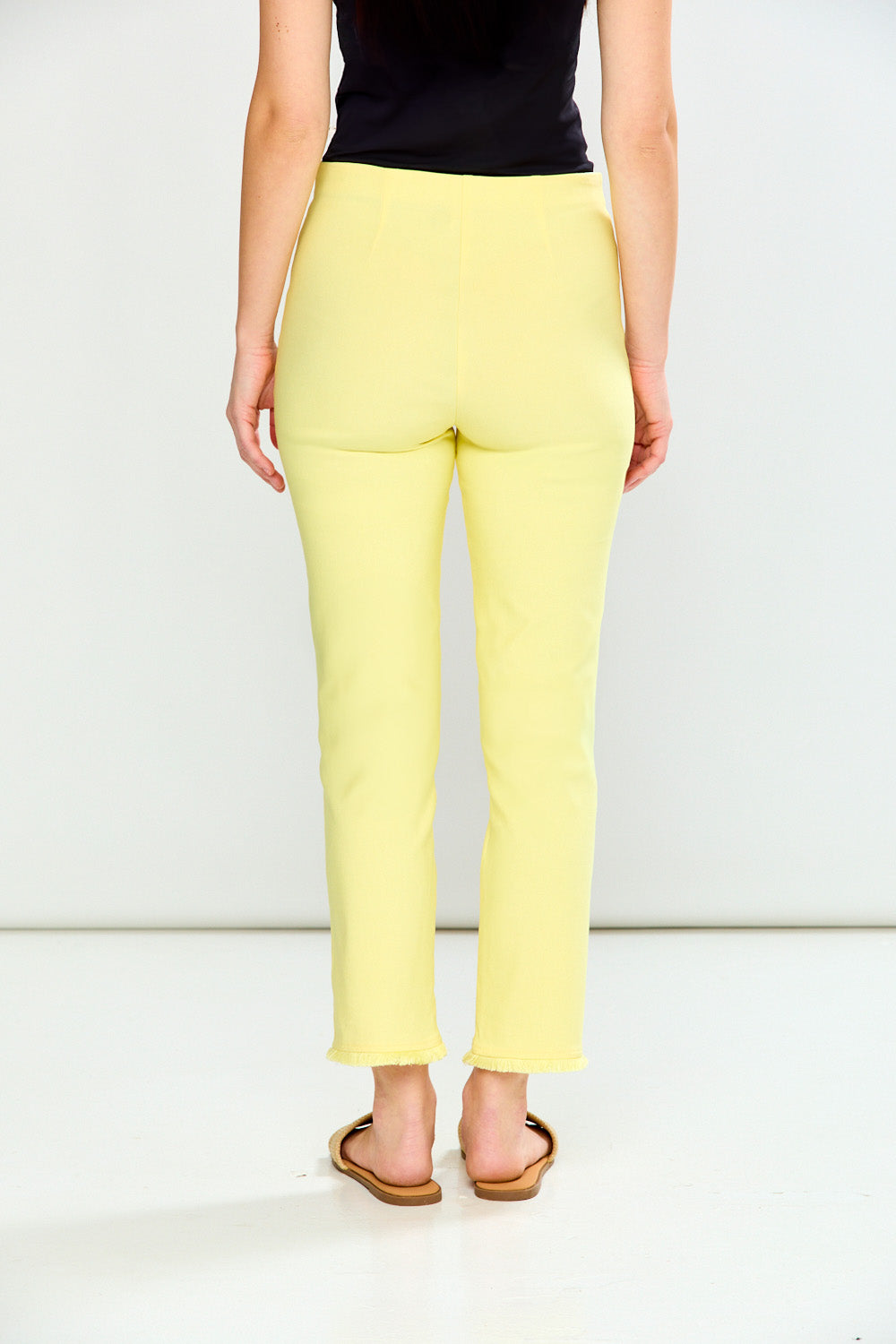 Person wearing Guava pants on a white background