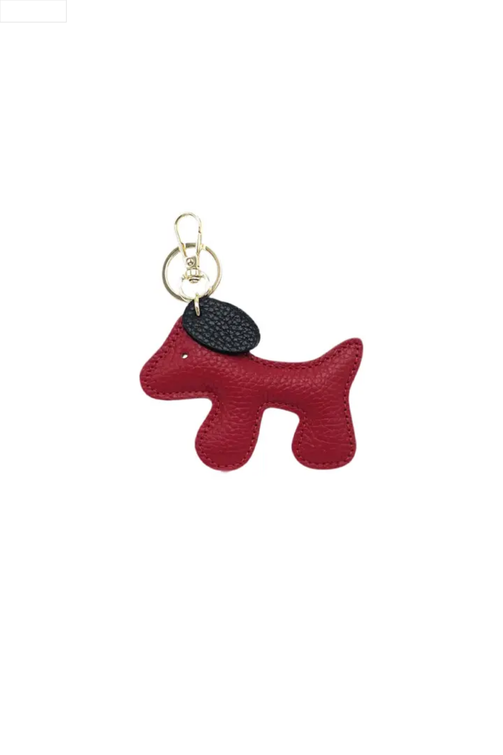 Dog-shaped keychain with a black tag on a white background