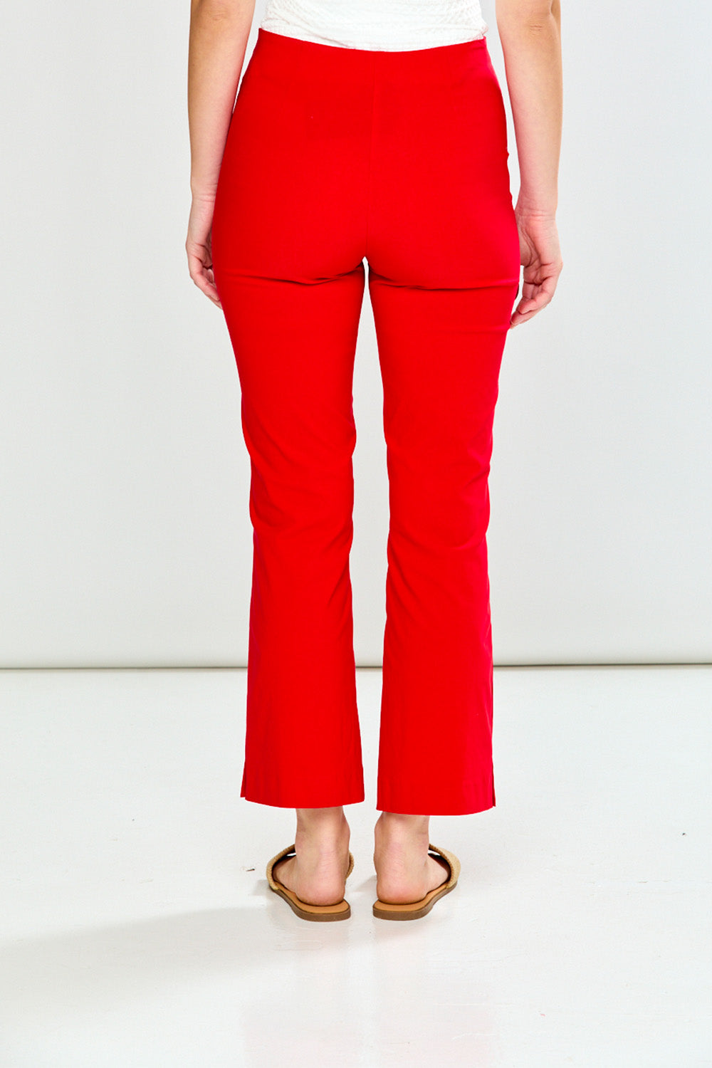 Person wearing red pants on a white background