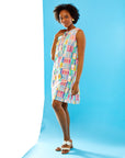 Woman in pink madras dress