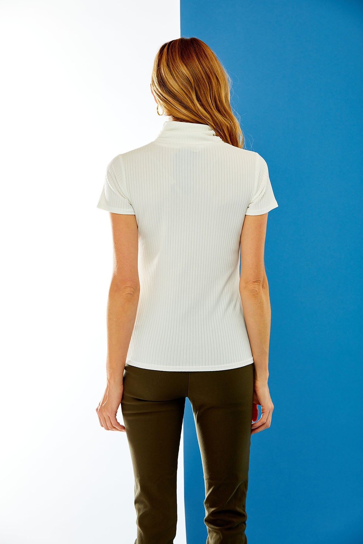 Woman in ivory short sleeve shirt