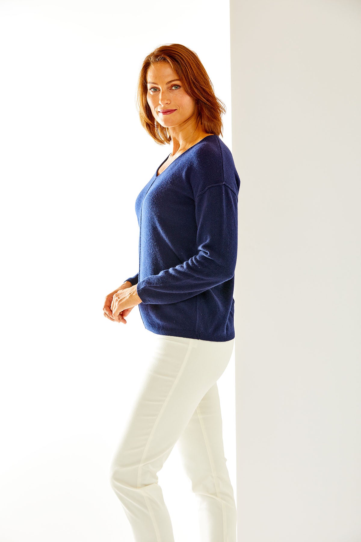 Woman in navy cashmere sweater