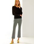 Woman in black/white houndstooth pant