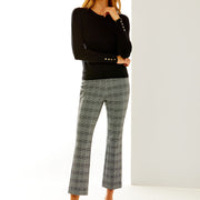 Woman in black/white houndstooth pant