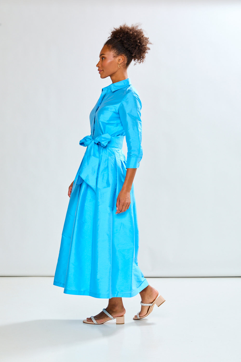 Woman in capri long taffeta dress