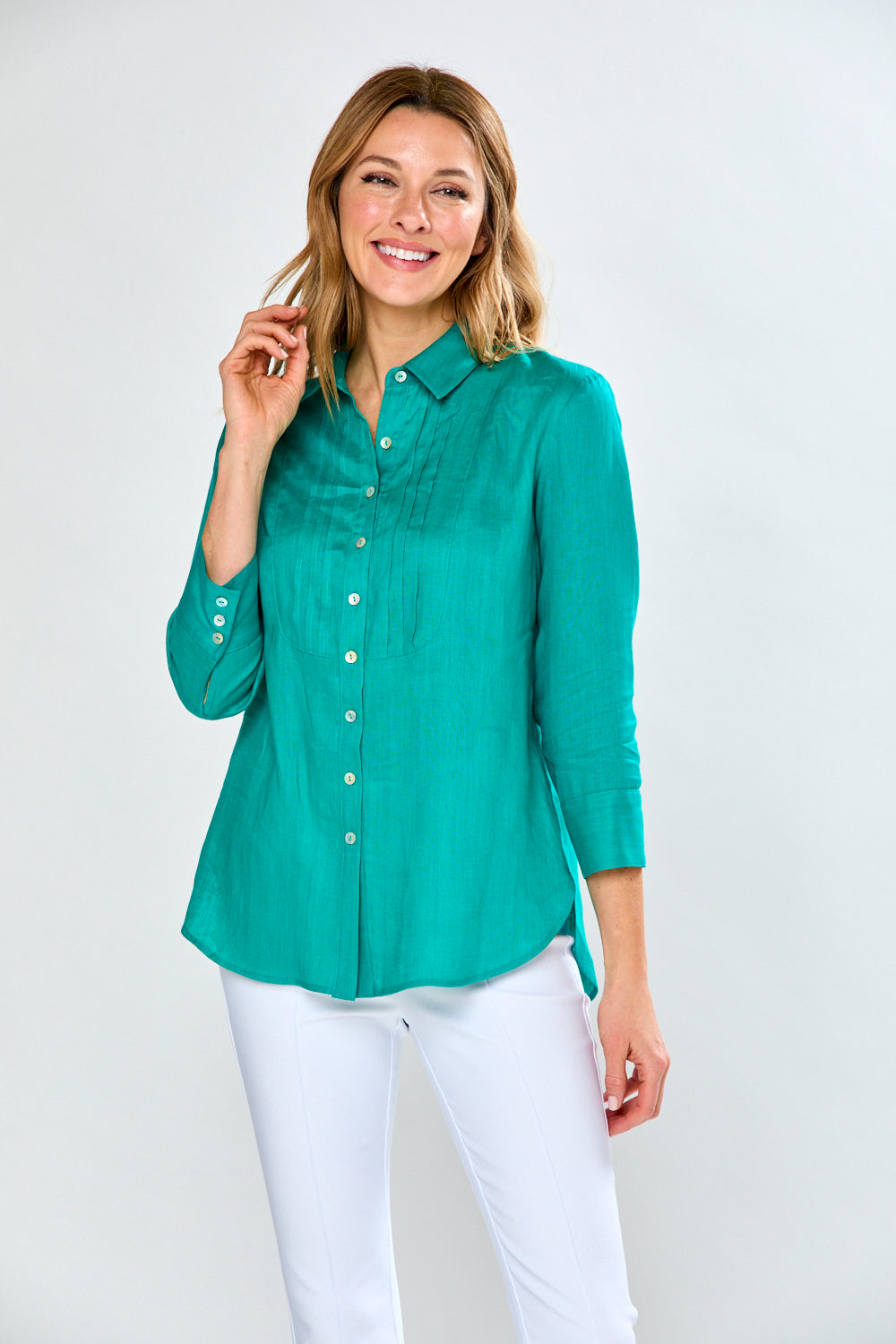 Woman in teal blouse