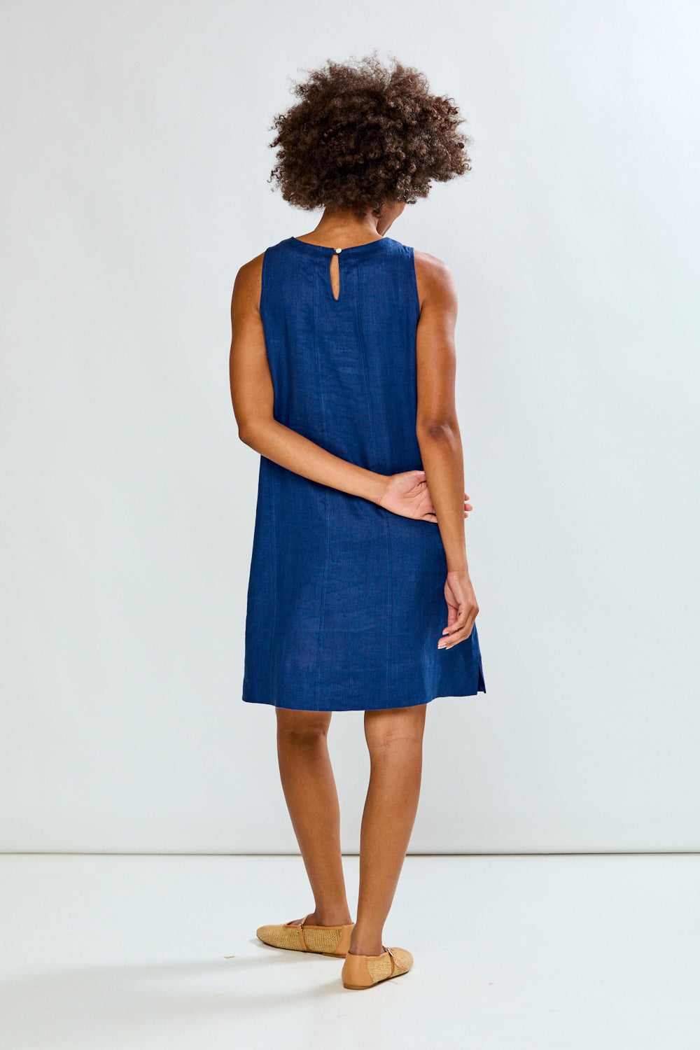Woman in navy linen dress
