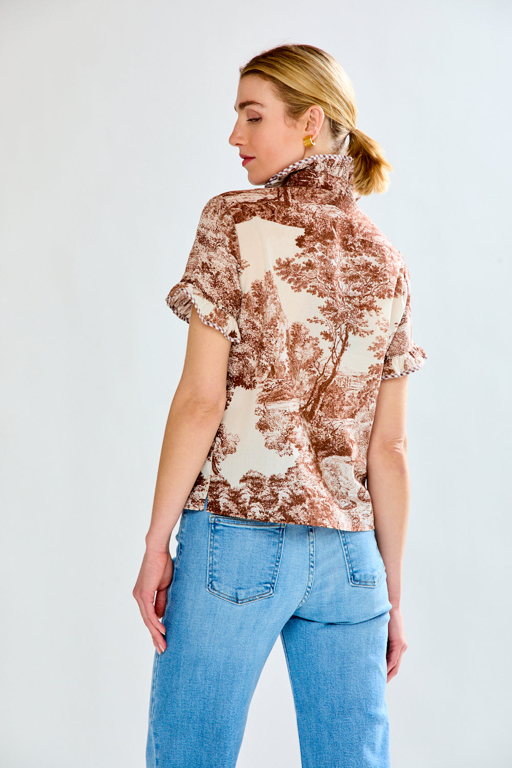 woman in brown toile top