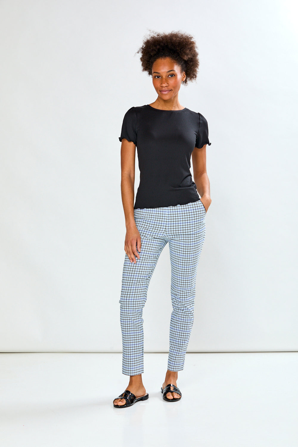 Woman in plaid pant