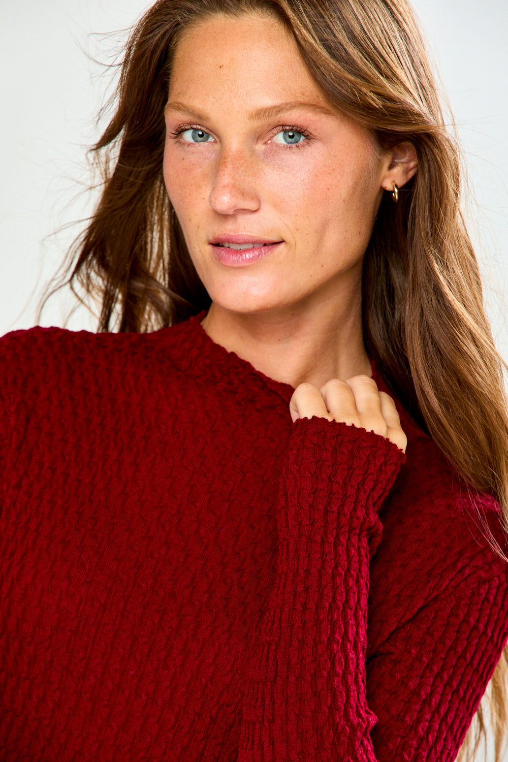 The Texture Long Sleeve in Aubergine modeled in a textured knit sweater with long sleeves for sophisticated fall style