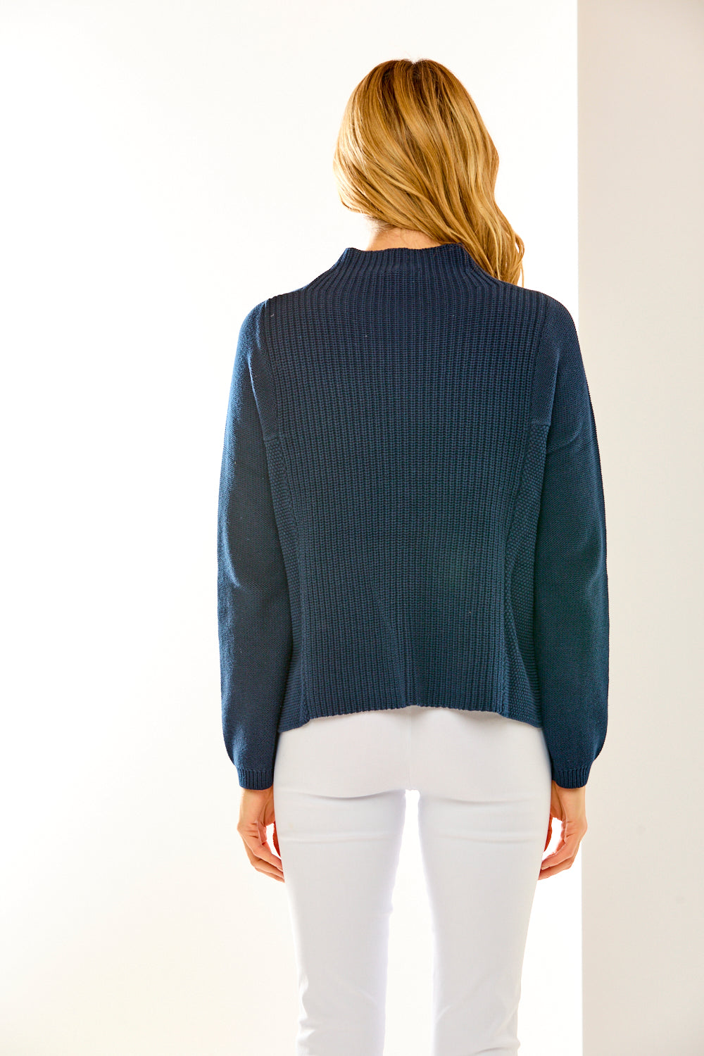 Woman in mock neck sweater