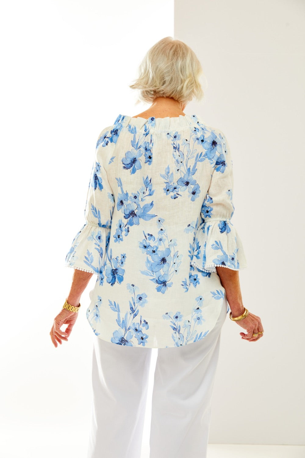 Woman in blue floral blouse