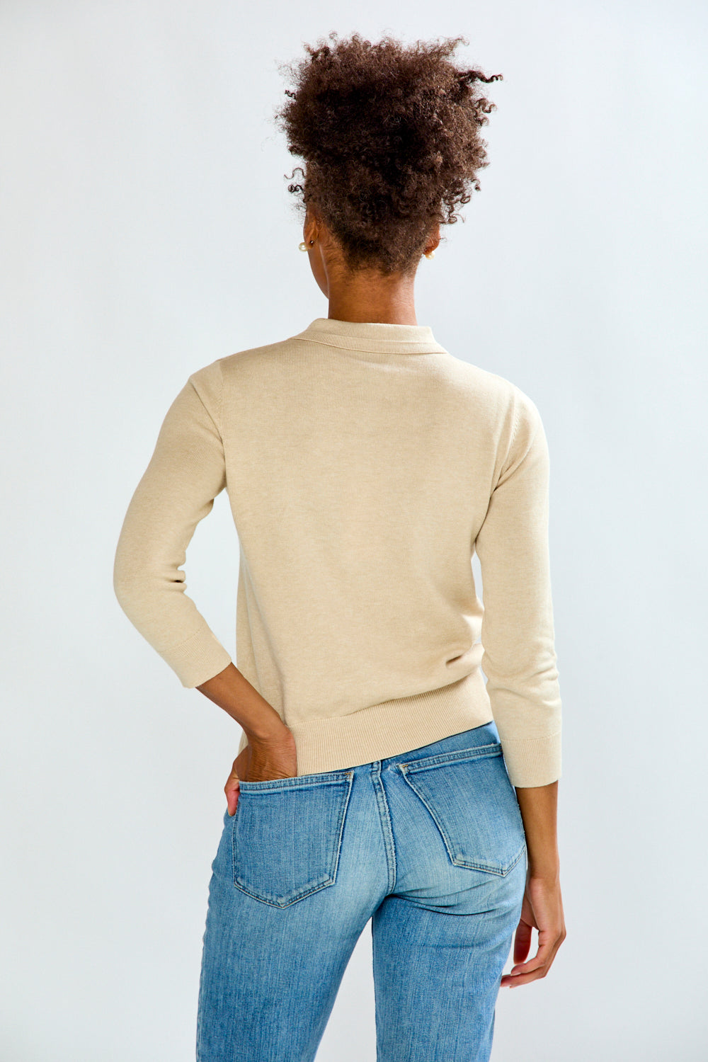 woman in sand sweater