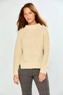 The Mix Stitch Mock Pullover - Oatmeal modeled in a textured cotton knit with long sleeves and a mock neckline styled with classic women's pants