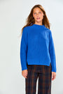 The Mix Stitch Mock Pullover - Royal blue cotton sweater with mock neck and textured mixed stitch detail styled with plaid pants on a model
