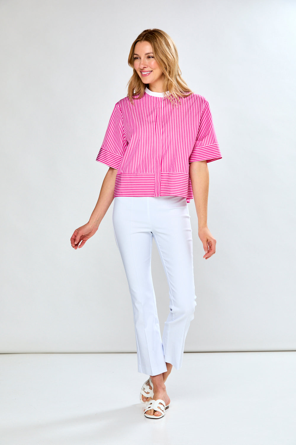 Woman in pink and white striped blouse