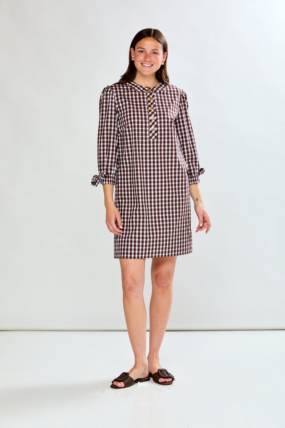 Woman in check dress