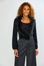 woman in black feather sweater 