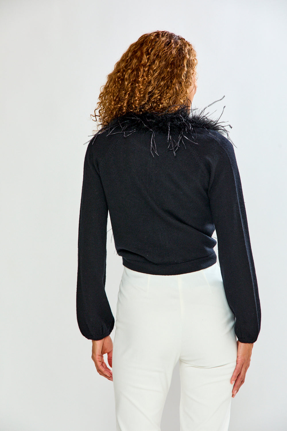 woman in black feather sweater 