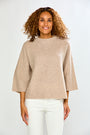 The Cashmere Ribbed 3/4 Slv Pullover - Oatmeal modeled by a woman with a relaxed fit, ribbed texture, round neckline, and three quarter sleeves