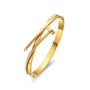 Gold bracelet with a white background