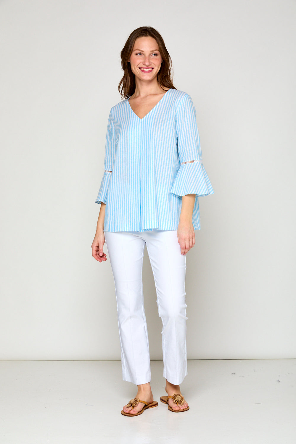 Woman in blue and white striped blouse