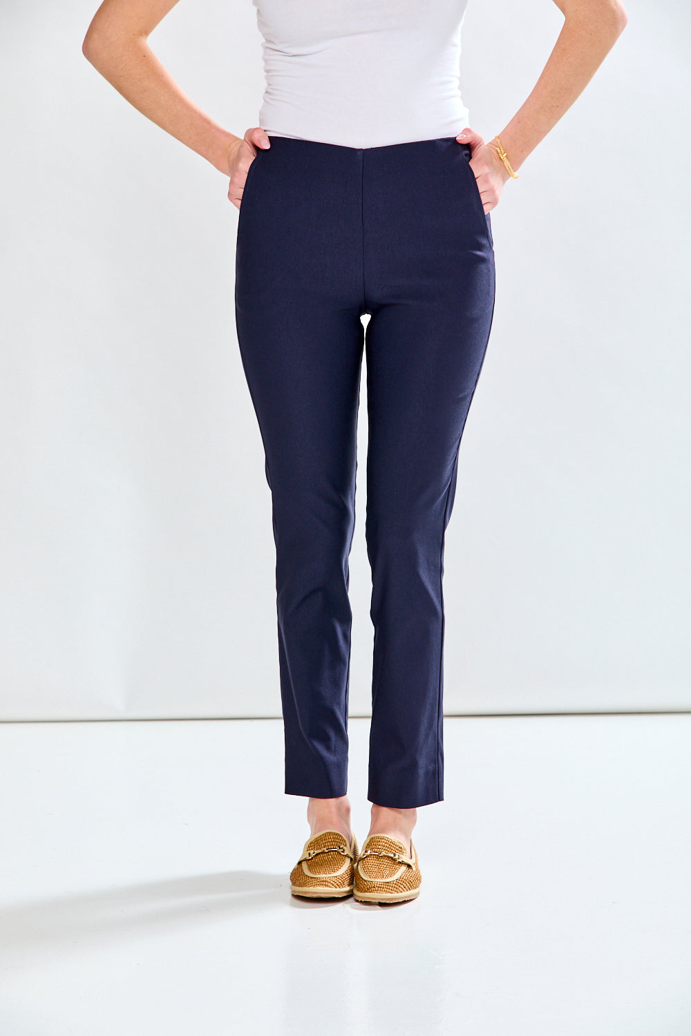 Woman in navy fitted pant