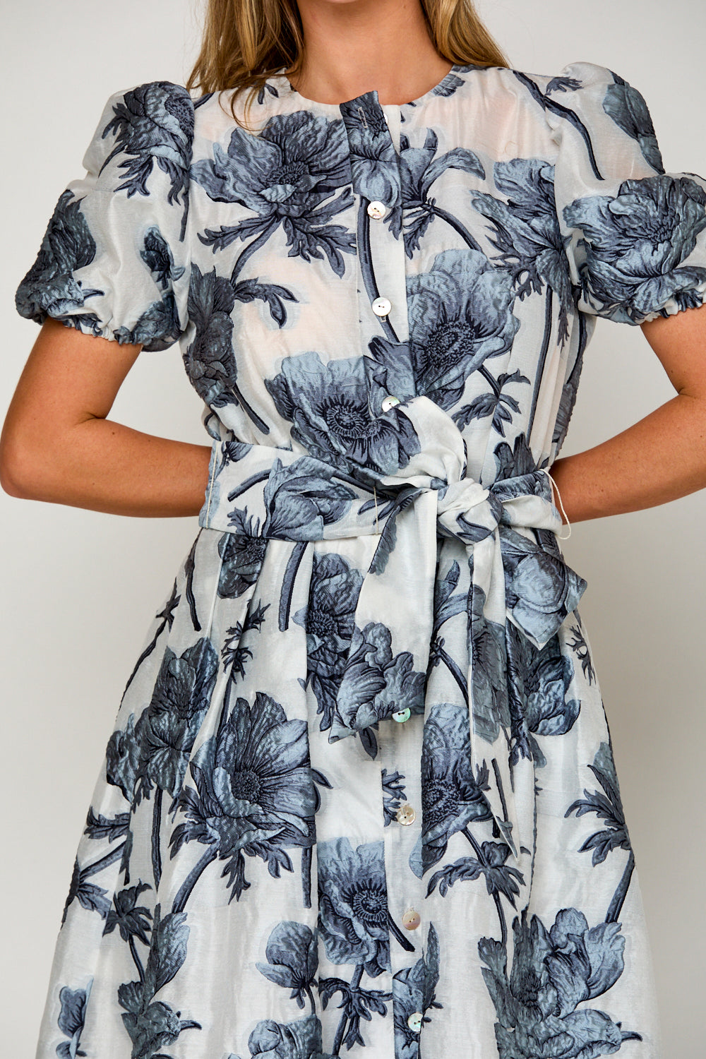 Woman in blue floral dress