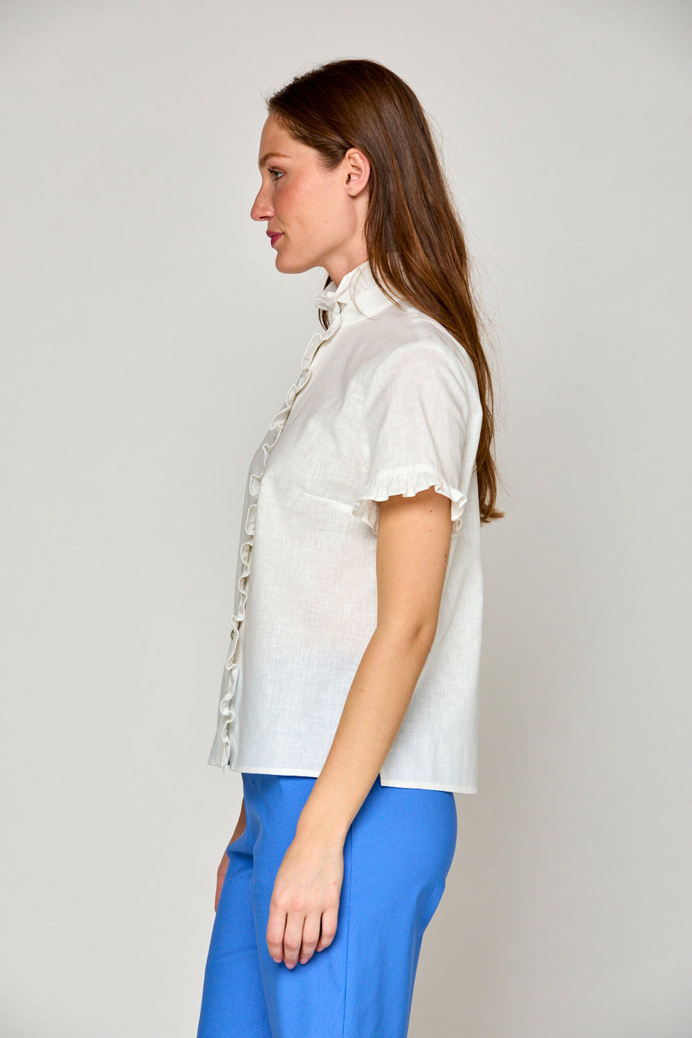 Woman in white short sleeve linen blouse