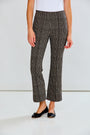 Person wearing houndstooth patterned pants on a plain background