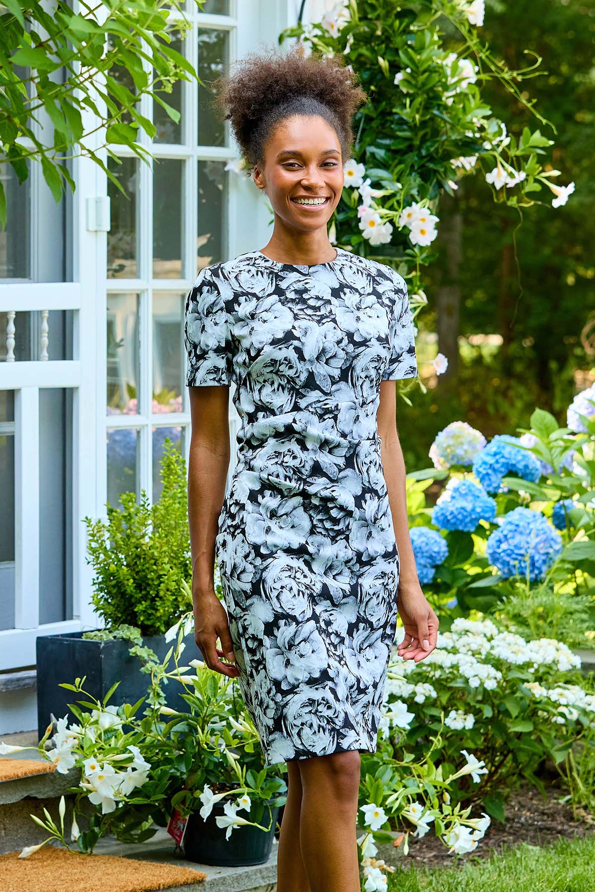 Woman in black roses dress