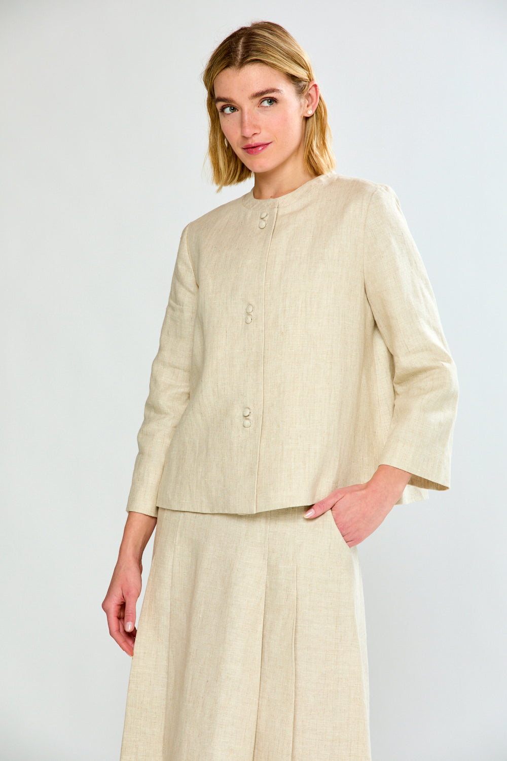 woman in light oatmeal coat