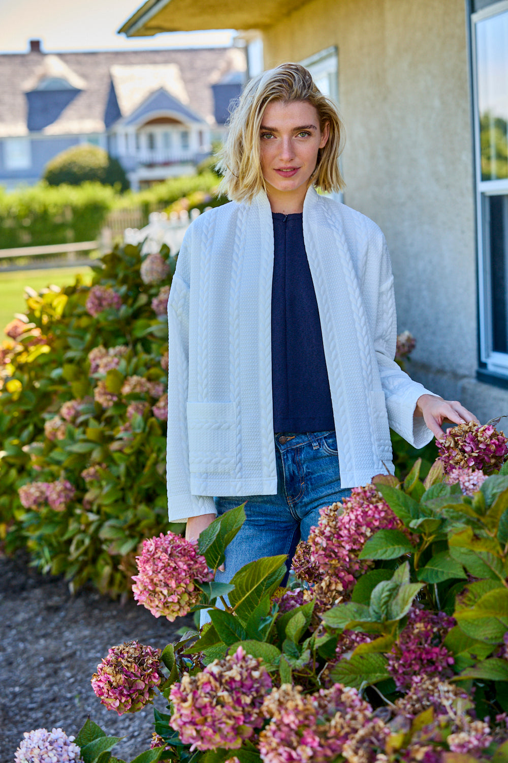 Woman with white open jacket on