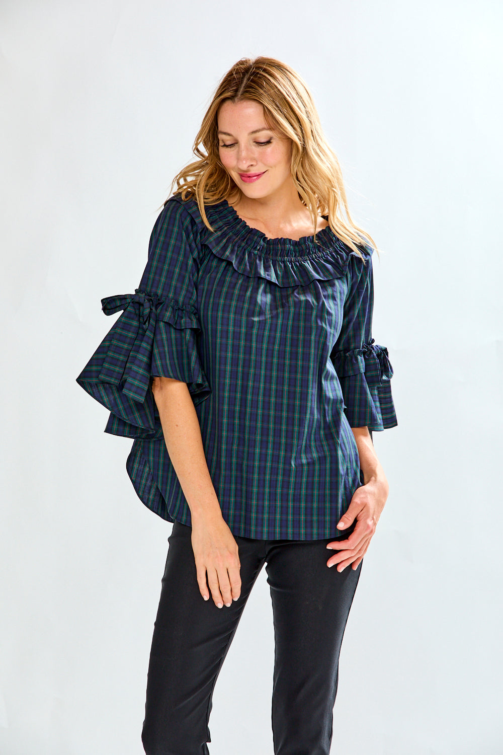Woman in plaid on/off shoulder top