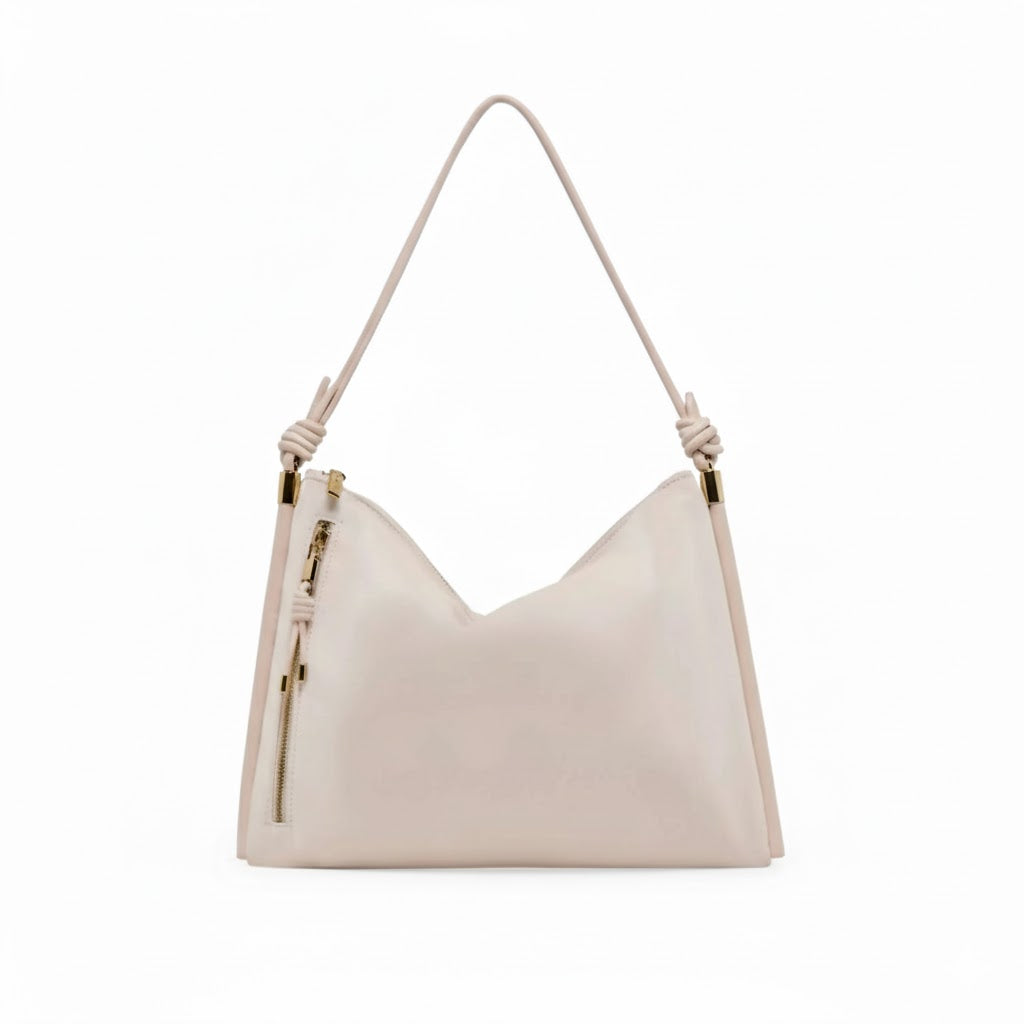 Beige handbag with a strap on a white background