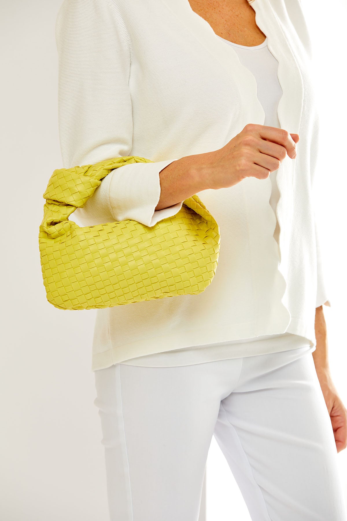 Woman holding a yellow bag