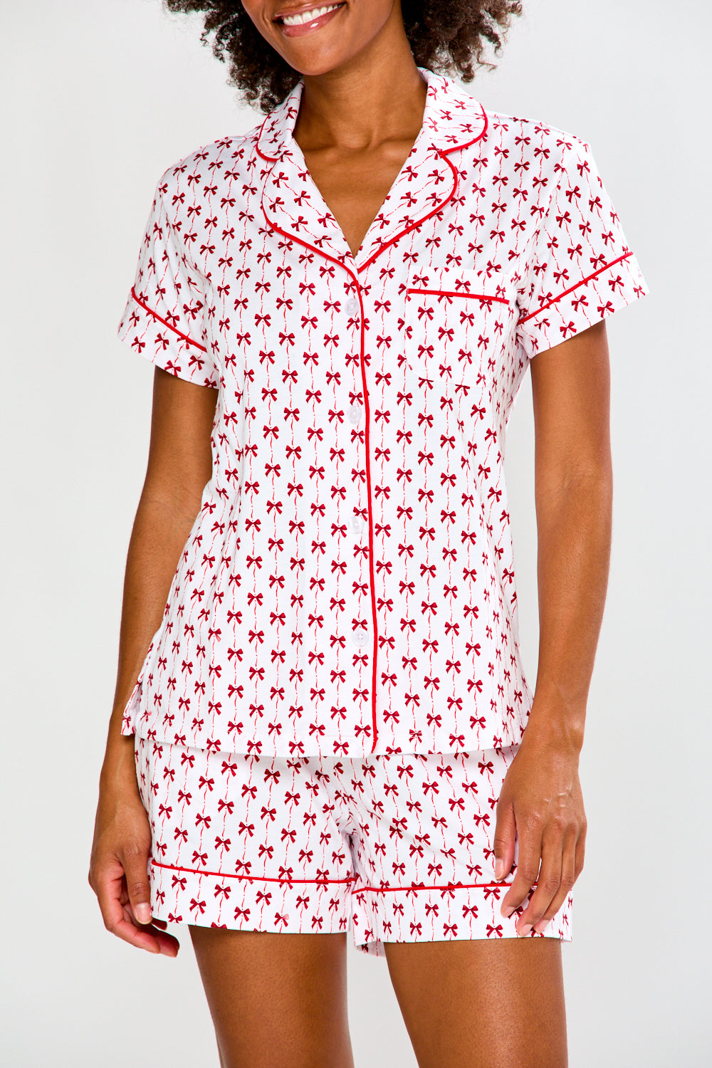 Woman in bow printed pajamas