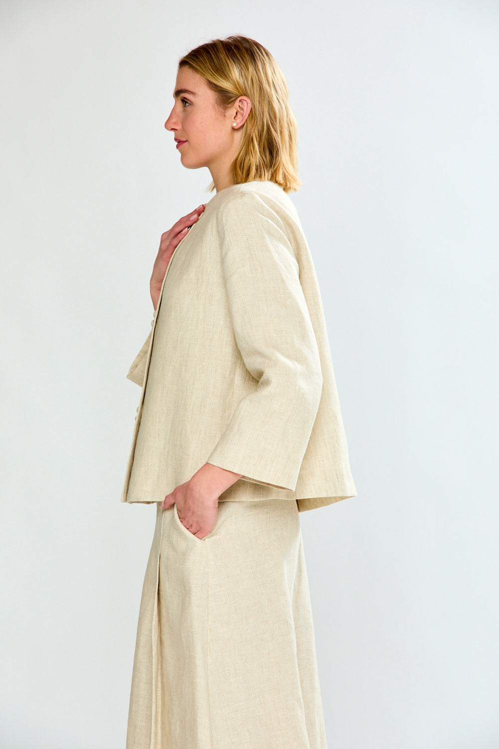 woman in light oatmeal coat