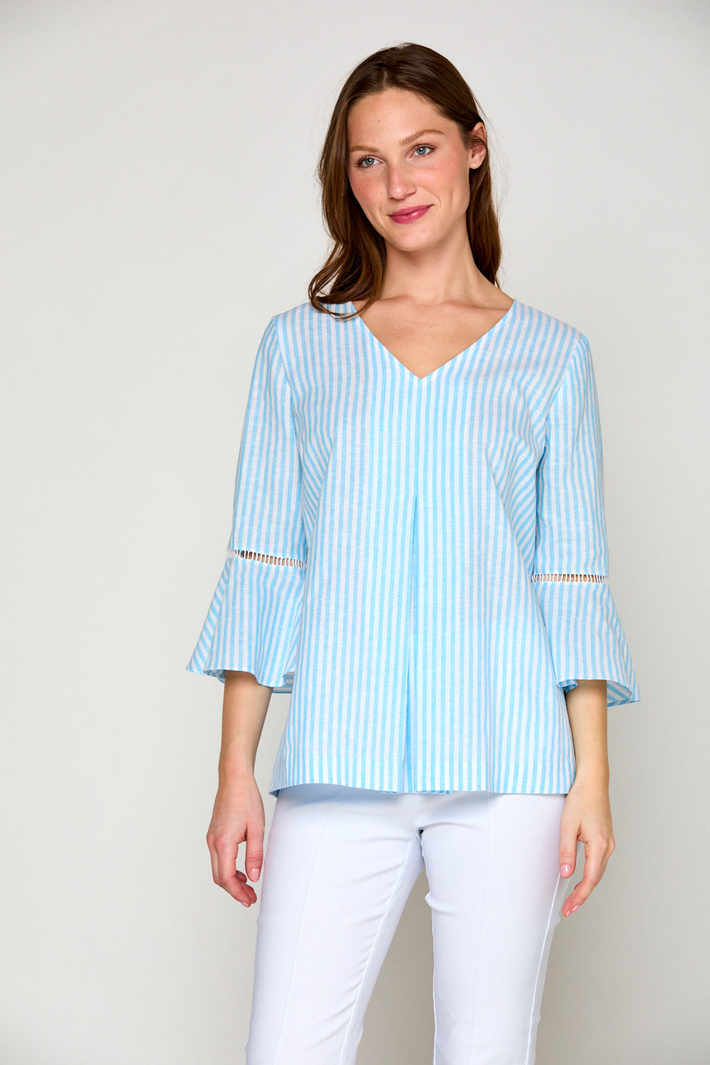 Woman in blue and white striped blouse